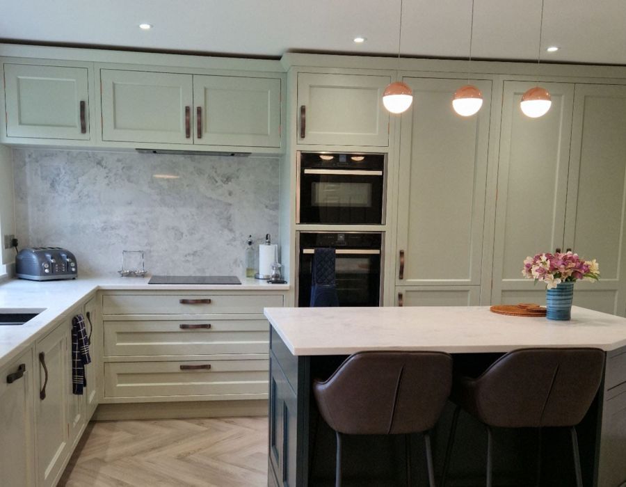 sage green kitchen with central island